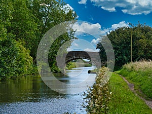 Two bridges on a quiet, rural section of the Leeds to Liverpool Canal in Lancashire, UK.