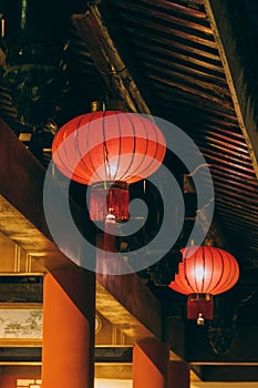 Two bright red lanterns under the eave in Liuzhou, Guangxi, China.