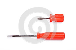 Two bright red screwdrivers on white background