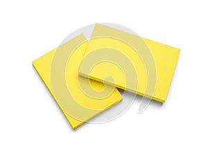 Two bright yellow sticky notes overlapping isolated on white background