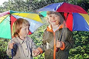 Two brothers play in rain