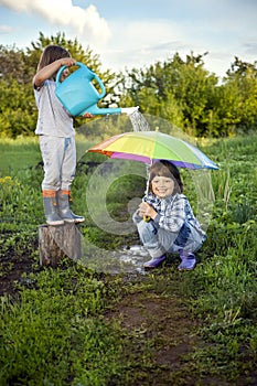 Two brothers play in rain