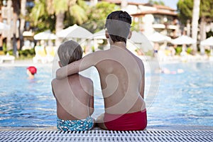 Two brothers are resting in the pool