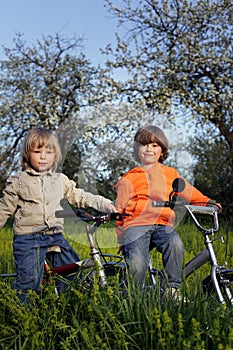 Two brothers ride bikes