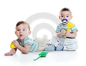 Two brothers with shovel and rake