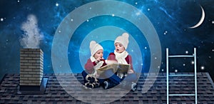 Two brothers sit on Christmas night on the roof and read a book with fairy tales.In anticipation of Christmas miracles.