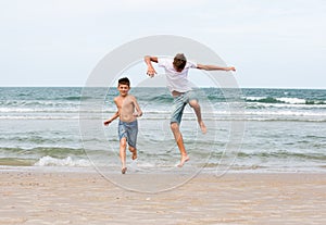 Two brothers of a teenager playing on the ocean, the friendship o