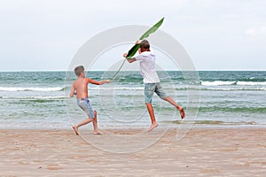 Two brothers of a teenager playing on the ocean, the friendship o