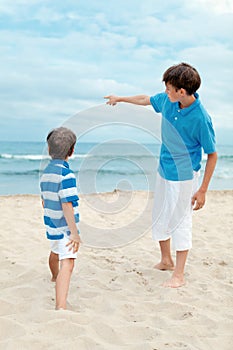 Two brothers on walk near sea