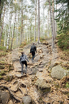 Two brothers are walking on mountains in Ukraine