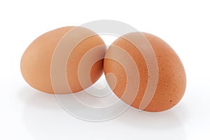 Two brown chicken eggs