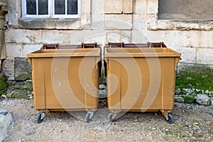 Two Brown Dumpsters