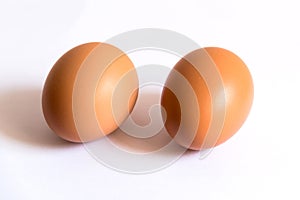 Two Brown Eggs in White Background