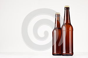 Two brown longneck beer bottles 500ml and 330ml mock up.