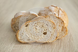 TWO BROWN SLICED CRUSTY FRENCH BREAD