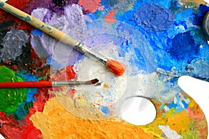 Two Brushes lay on an art palette photo