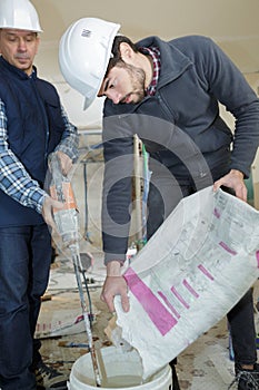 two builders making cement