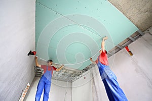 Two builders are mounted ceiling in the new photo