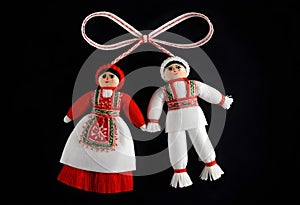 two bulgarian martenitsa dolls in traditional russian clothing
