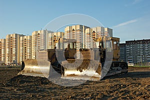 Two bulldozers in morning