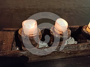 Two burning candle lights in wooden case with amazing background. Candlelight, candlelight for couples, candlelight dinner