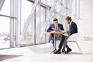 Two business colleagues at meeting in modern office interior