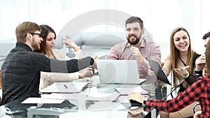 Two business colleagues shaking hands during meeting