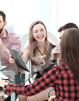 Two business colleagues shaking hands during meeting