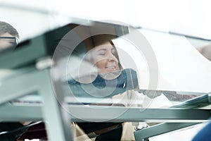 Two business colleagues shaking hands during meeting