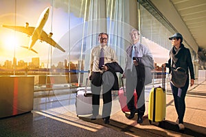 Two business man and woman with traveling luggage walking in air