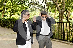 Two business men in park
