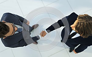 Two business men shaking hands in the office