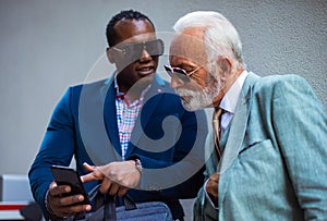 Two business men talking on the street