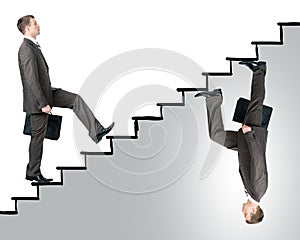 Two business men walking up stairs