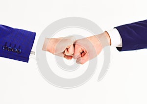 Two business partners giving each other fist bump