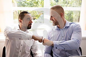 Two Business Partners Making Fist Bump