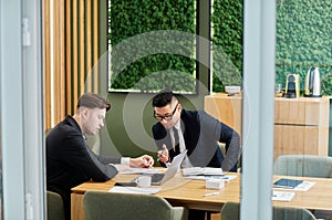 Two Business Partners Meeting in Conference Room