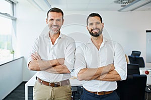 Two business partners standing together in modern office