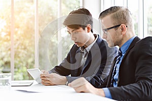 Two business people discussing work in the office in meeting