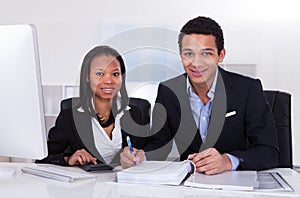 Two Business People Doing Finance Work