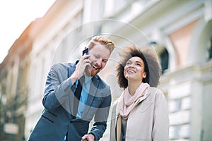 Two business people in an informal conversation