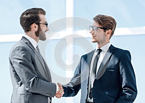 Two business people shaking hands