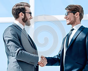 Two business people shaking hands