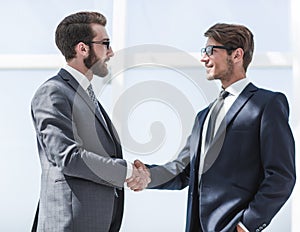 Two business people shaking hands