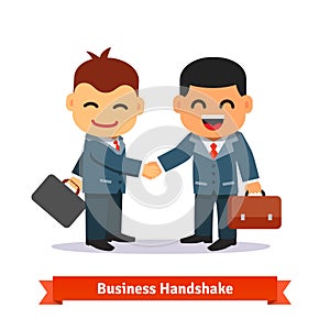 Two business people shaking hands