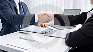 Two business people shaking hands of Candidate asian businesswoman after successful negotiations or interview, career and