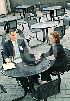 Two Business People Sit Outdoor