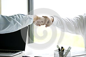 two business people use hand to fist bump for succes teamwork coporate Partner Business