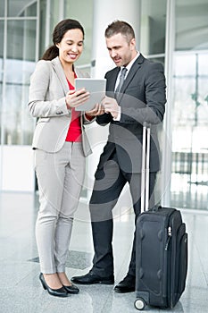 Two Business People Waiting in Airport