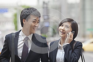 Two Business People Walking Together